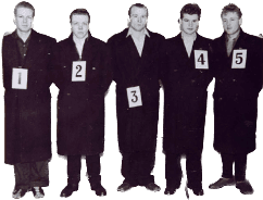 Line up of people holding numbers from 1 to 5.